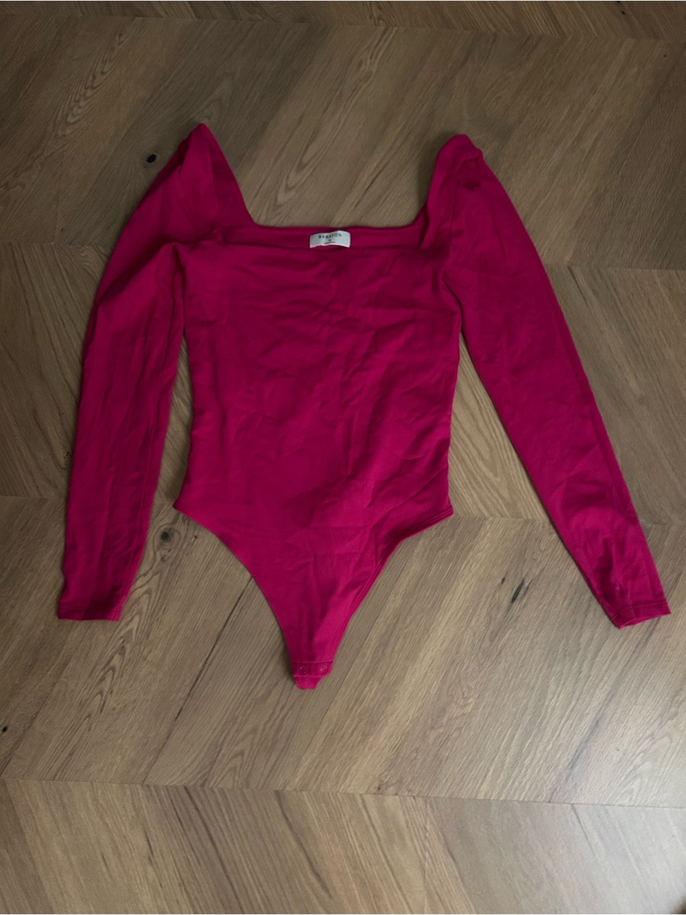 Babaton Long-Sleeve One-Piece Bodysuit in Bright Pink